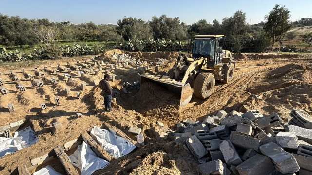 One excavator, 10,000 bodies, a sea of rubble: inside Gaza’s effort to retrieve and bury its dead